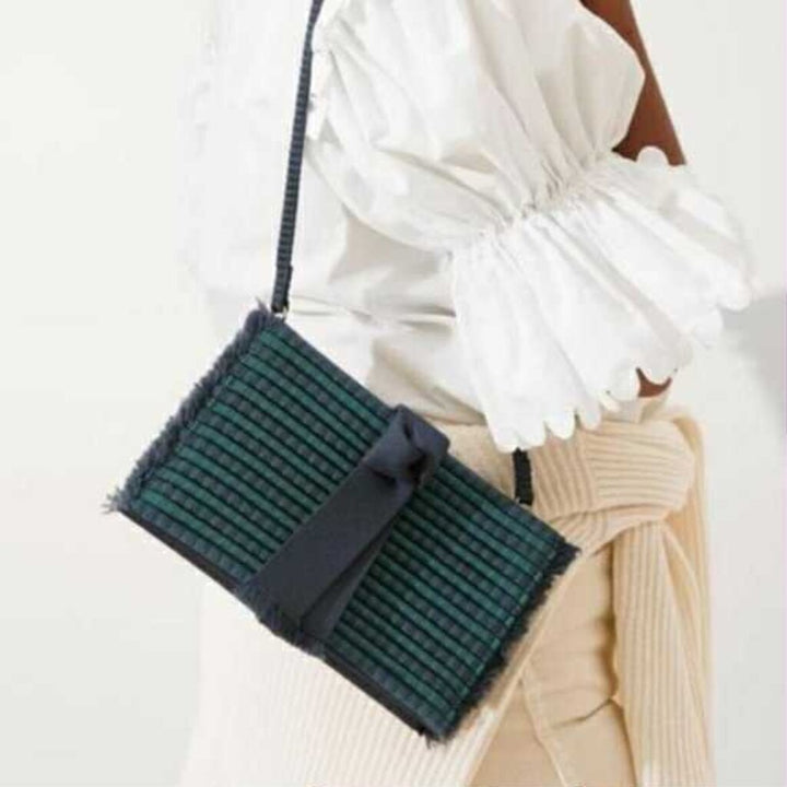 Rothy’s Navy Blue Tassel Clutch (Retails for $100)