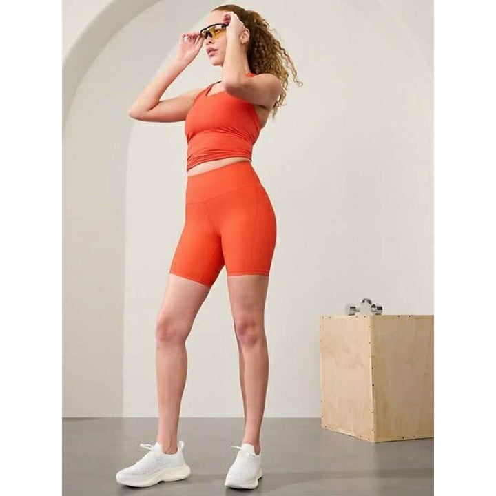Athleta Interval Stash Shorts In Orange - Size Small